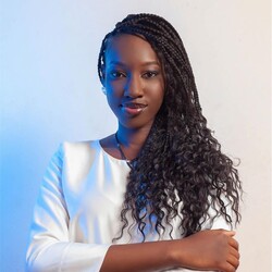Portrait of Aminatou in white top