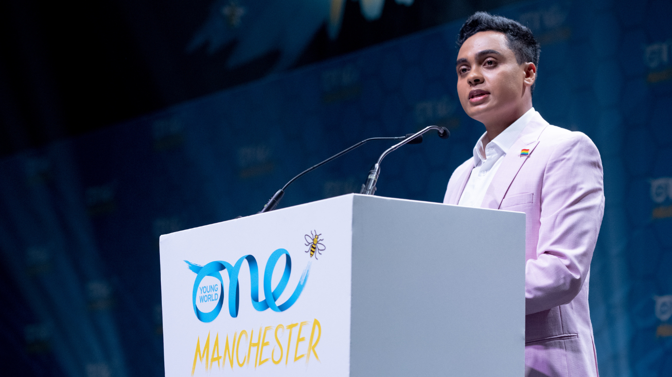 Elvis Martin speaking at the One Young World Summit Manchester 2022