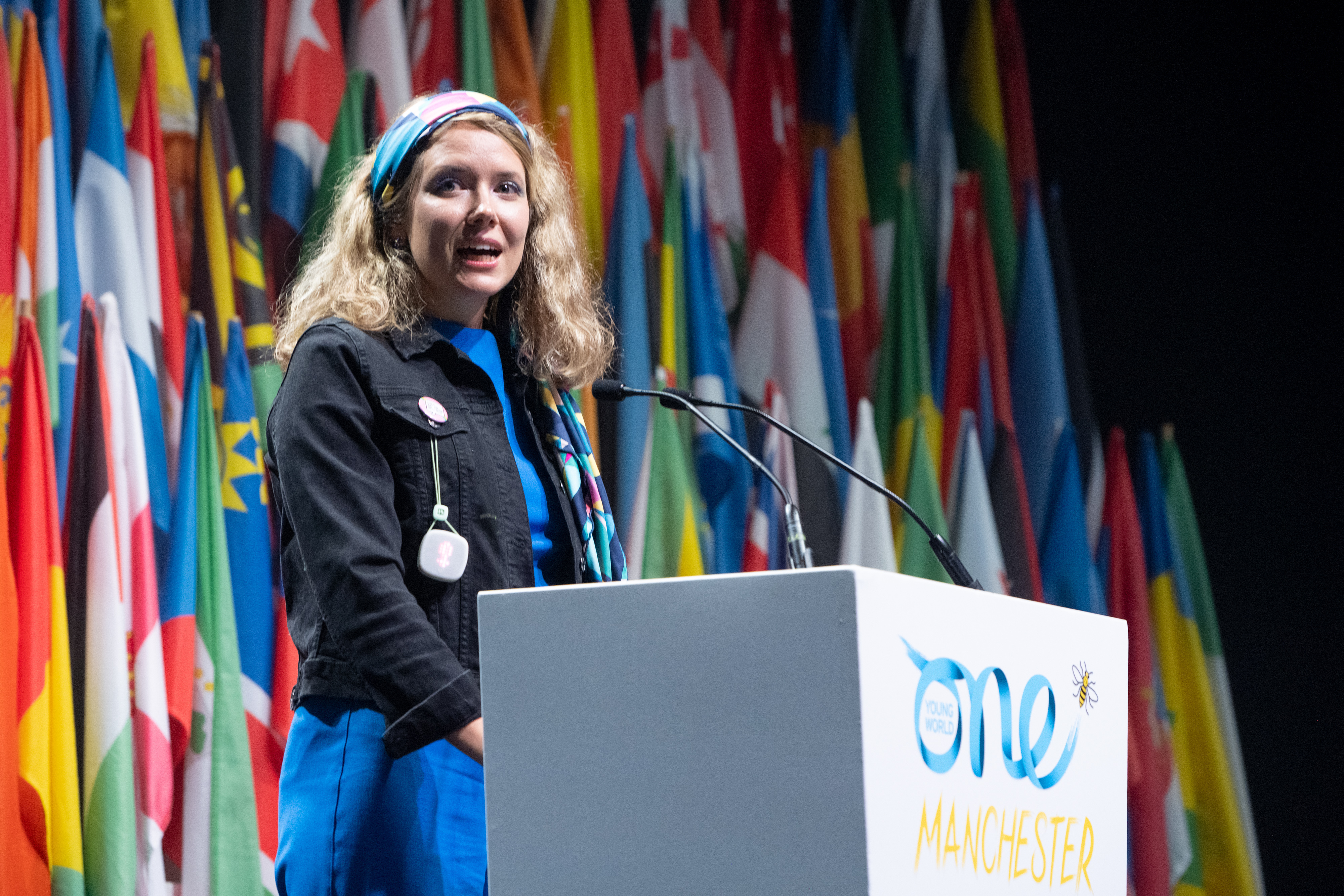 Dora speaking on the mainstage at the One Young World Summit Manchester, 2022