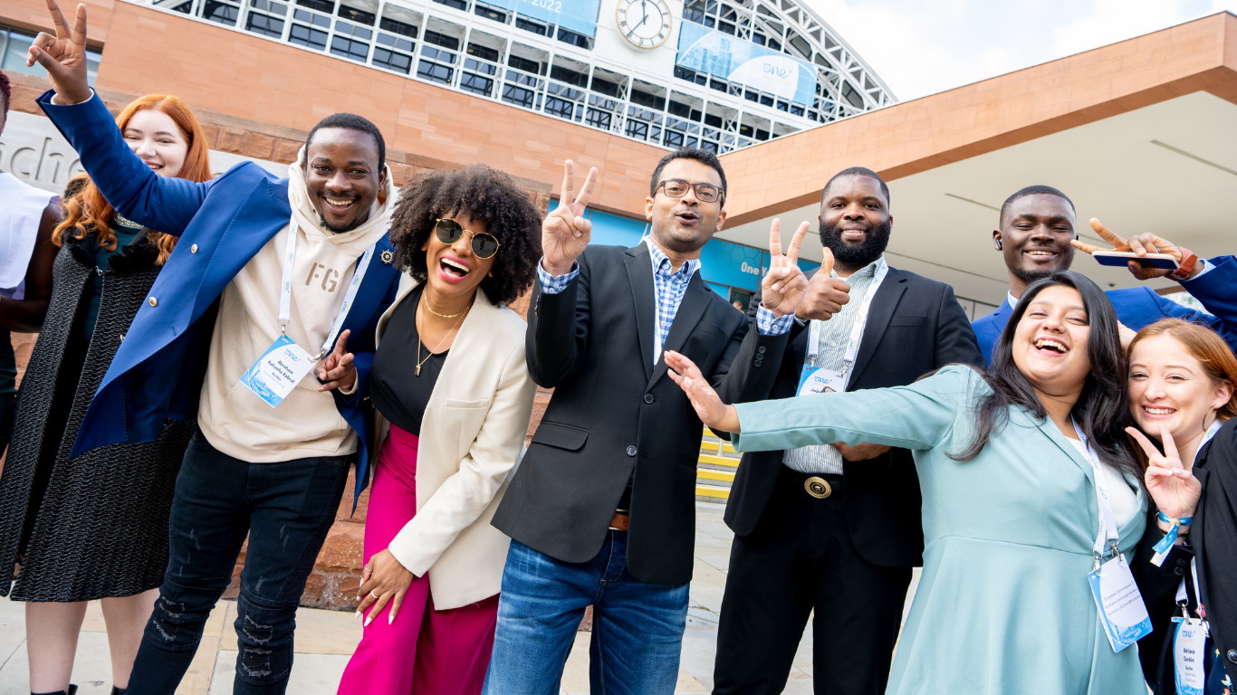 Delegates smiling at the One Young World Summit Manchester 2022