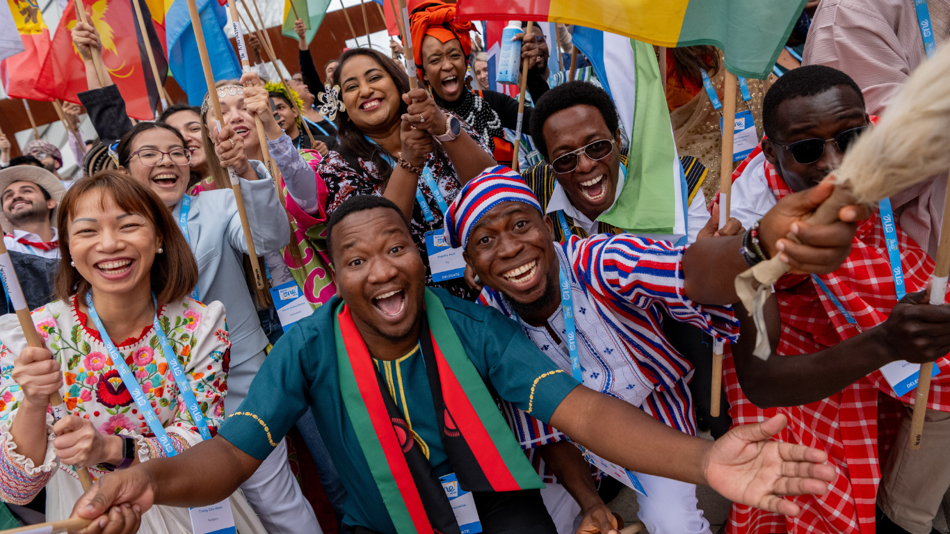 Image of flag bearers at the One Young World Summit Belfast 2023
