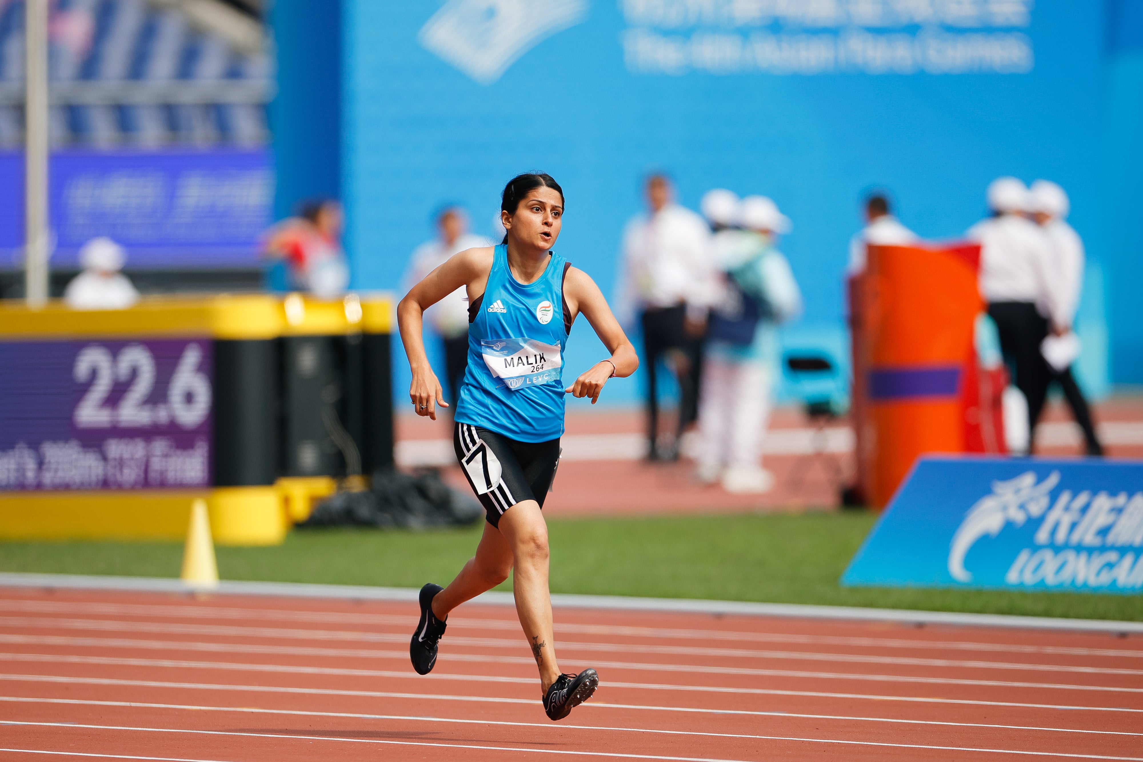 Devika running at the 4th Asian Para Games 