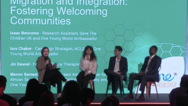 Panellists waiting to discuss the topic of "Migration and Integration: Fostering Welcoming Communities" at a OYW Summit