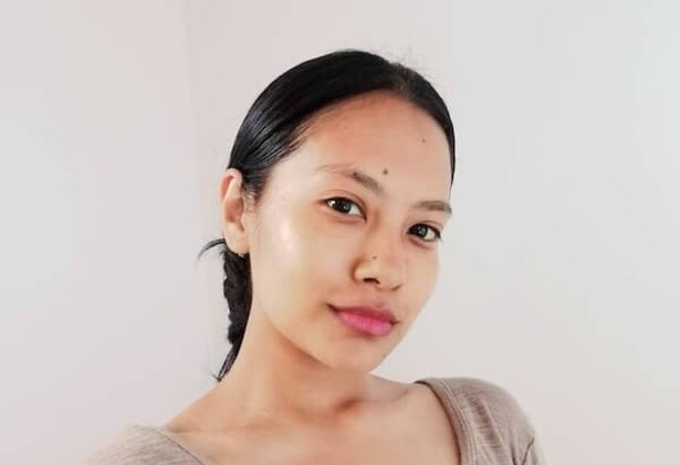 Portrait of Senchhen Hangma Limbu in beige top against beige background