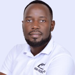 Portrait of Eddy Balina in white polo against grey background