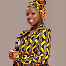 Juliet Namujju in colourful patterned suit